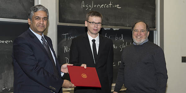 Madars Virza, first place winner of the William Martin Prize for best masters thesis in computer science received the award from Prof. Chandrakasan, left and is joined by his advisor Prof. Ron Rivest (photo right).