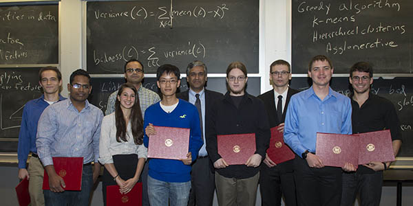 The group of EECS Celebrates Fall 2014 awardees in a group photo with Profs. Chandrakasan, center back row and Shah, second from left back row.