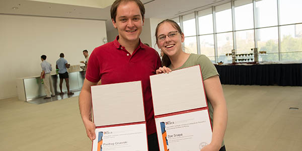 Predrag Gruevsky, left, and Zoe Snape present their SuperUROP graduation certificates.
