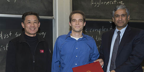 David Burghoff is awarded by Prof. Chandrakasan the first Jin Au Kong doctoral thesis award in electrical engineering. His advisor Prof. Qing Hu joins him, photo left.