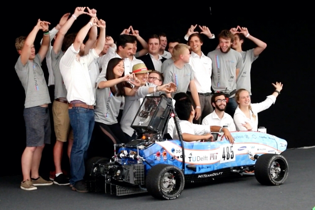 MIT Driverless and TU Delft pose with their race car, DUT19, at Formula Student Germany 2019. The joint team placed third overall. Photo: Delft Driverless
