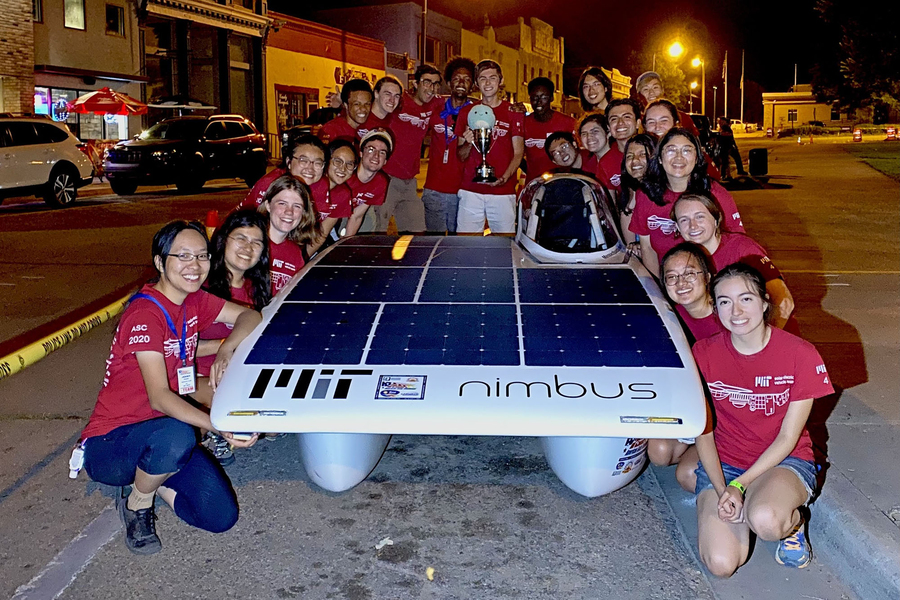 Caption:The MIT Solar Electric Vehicle Team poses with Nimbus, their solar car, after winning the 2021 American Solar Challenge. Credits:Photo courtesy of MIT SEVT.