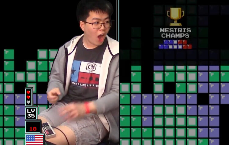 Justin Yu, a young Asian American man, reacts with shock to his win at the Classic Tetris World Championships.