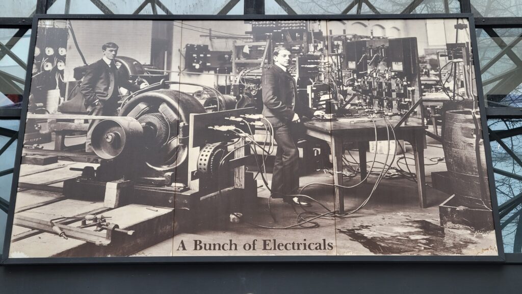 The famous "A Group of Electricals" photo which hangs above the entry lobby of Building 34.