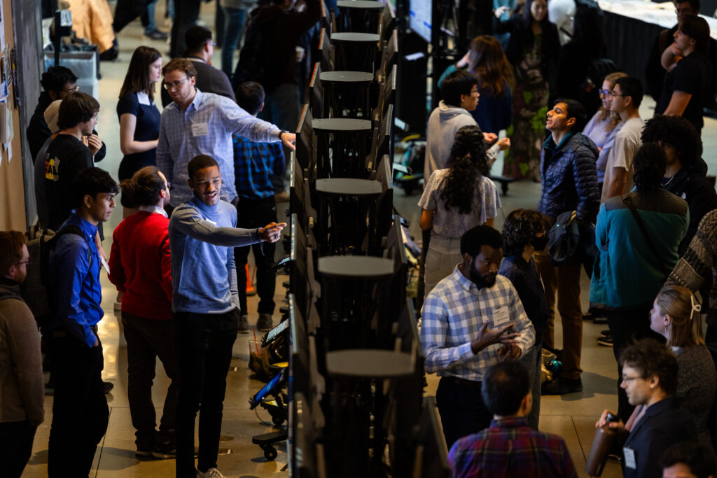 A view over the annual SuperUROP poster session, held in MIT's Stata Center.